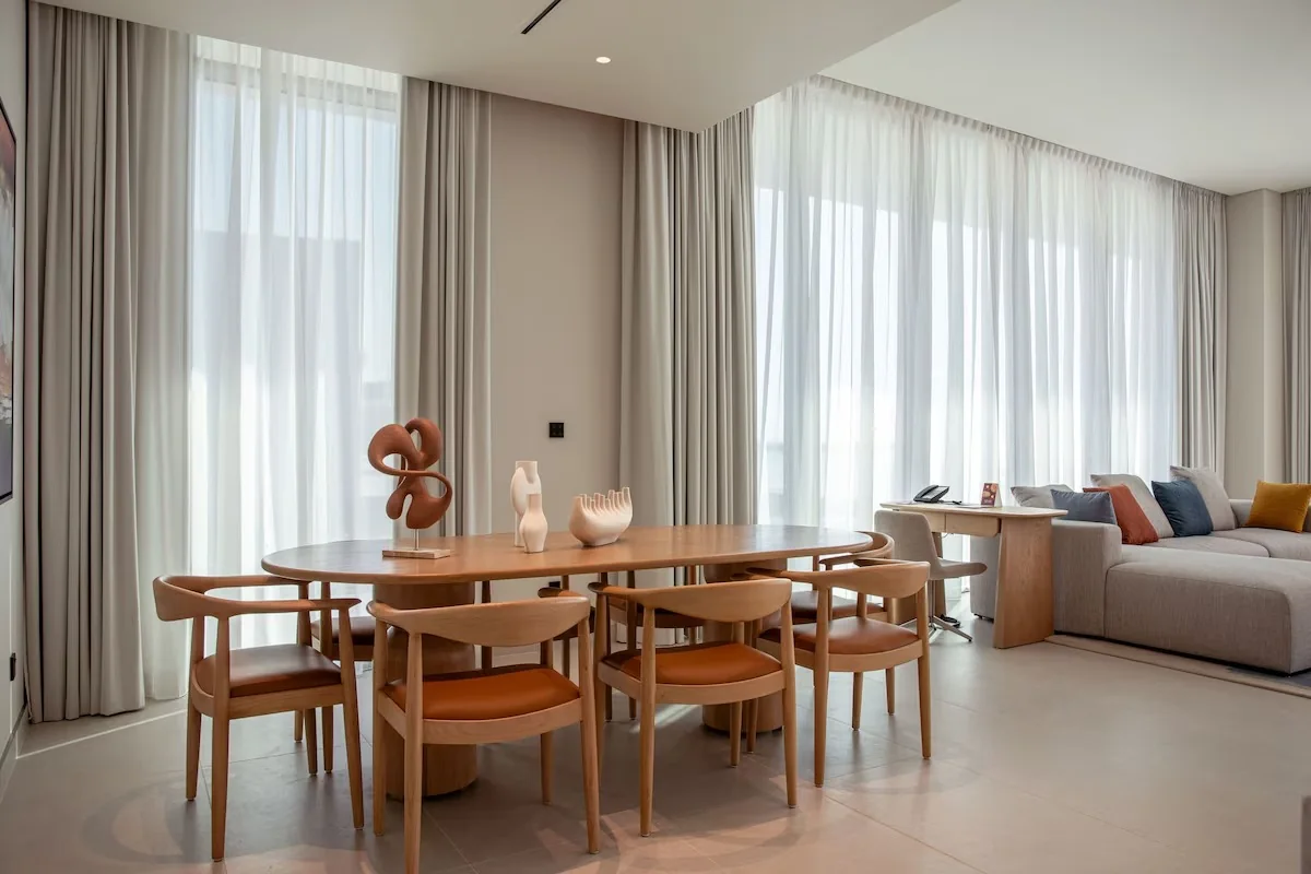 Hospitality villa dining and living interior at the Ajman project