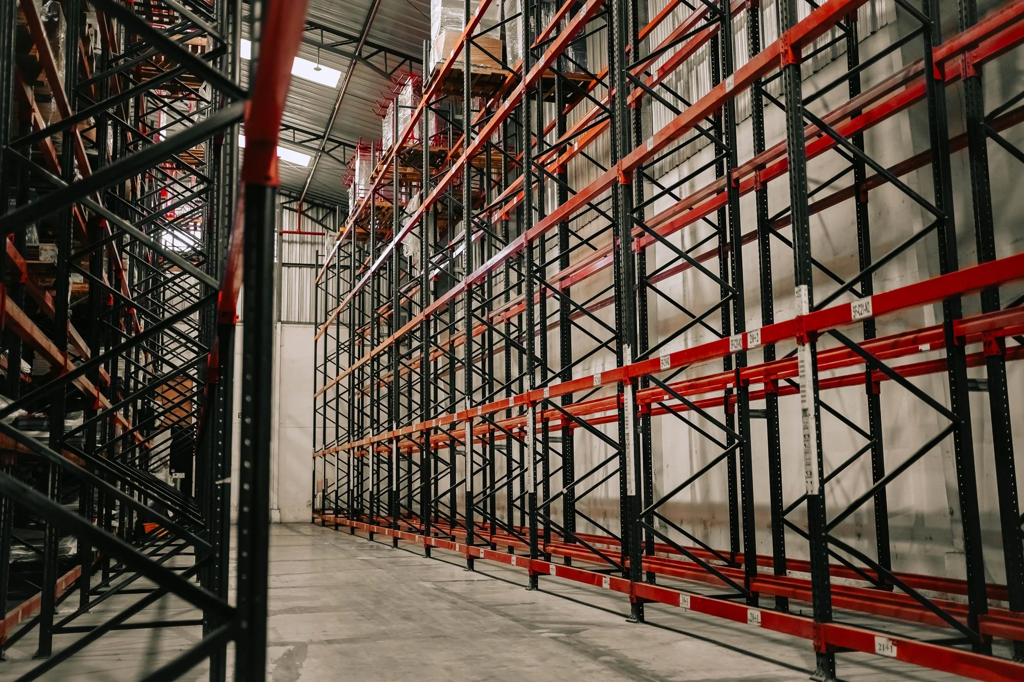 Representative industrial warehouse aisle with high storage racks