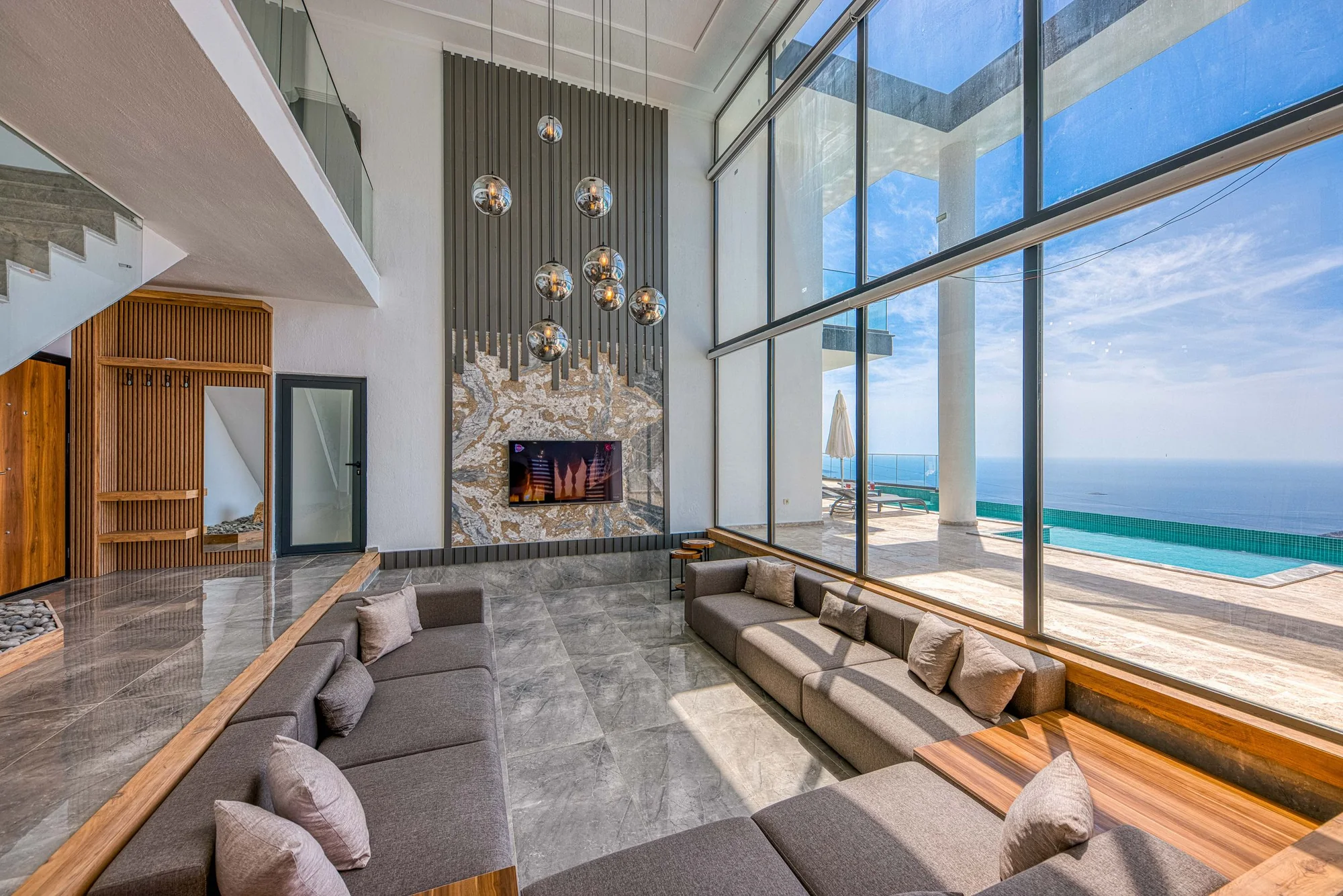 Representative modern villa living room with floor-to-ceiling glazing
