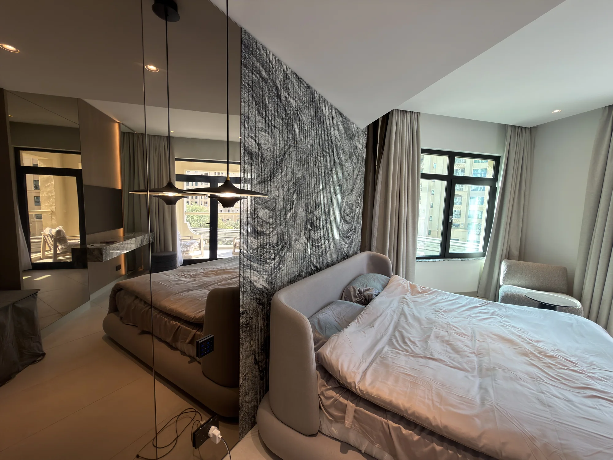 Bedroom and lounge interior with integrated lighting at the Shoreline residence